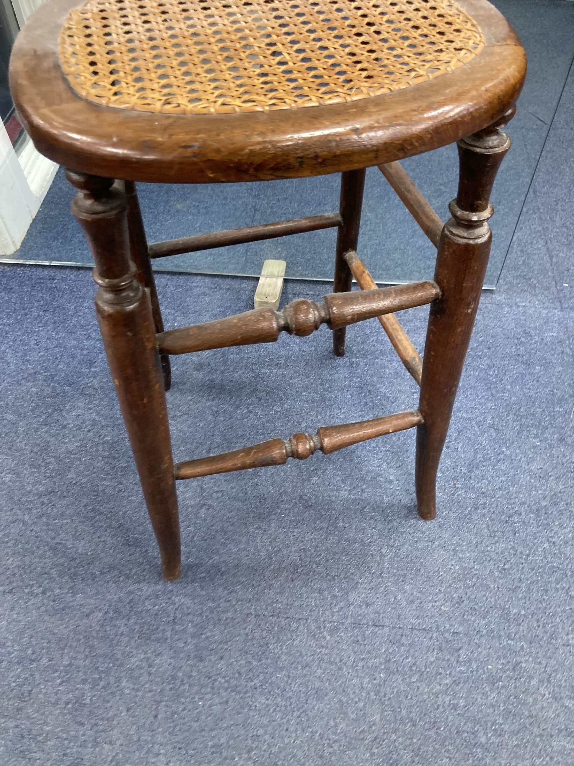 A Victorian beech cane seat correction chair